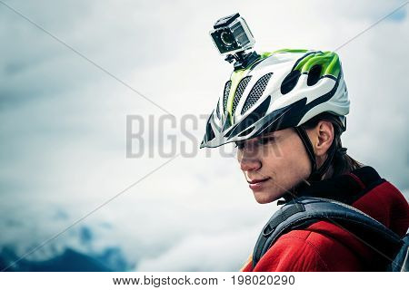 Female Mountain biker with Actioncam mounted on Helmet.