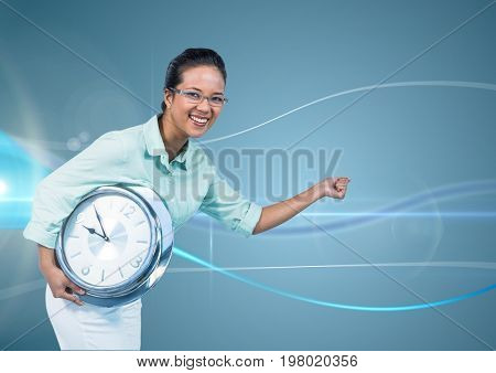 Digital composite of Woman holding clock in front of blue curved background