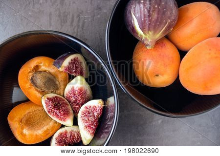Fresh ripe figs. Juicy apricots. Concept - healthy eating vegetarianism.