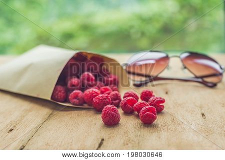 Summer Holiday, Vacation, Relaxation Concept. Raspberries, Straw Hat. Free Text Copy Space. Summer V