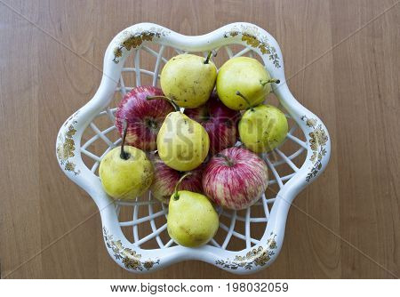 Plate of red apples and yellow pears