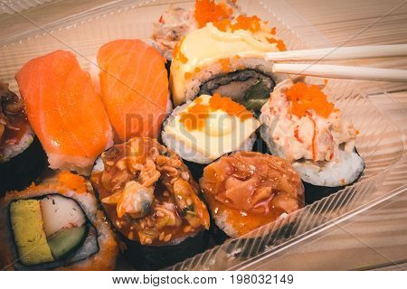 Japanese Food Sushi In Plastic Box On Japanese Table. Set Of Sushi, Original Style Japanese Food Pac