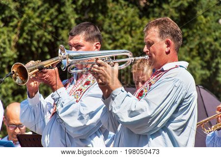 Buchlovice Czech Republic July 29 2017: Traditional brass band at folk festivals. Traditional farmers harvest celebrations of garlic