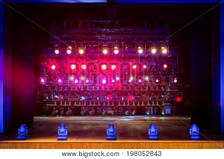 Lighting equipment on the stage. Multi-colored lights.