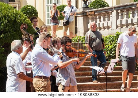 Buchlovice Czech Republic July 29 2017: Man playing the violin at folk festivals in the castle Buchlovice . Traditional farmers harvest celebrations of garlic.