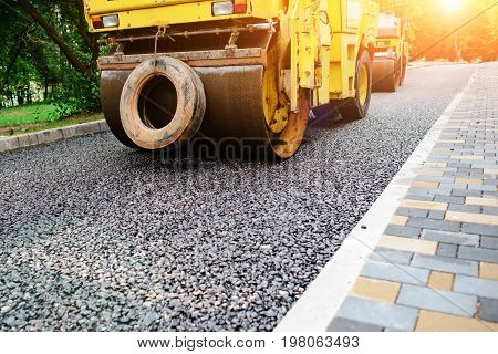 Carrying Out Repair Works: Asphalt Roller Stacking And Pressing Hot Lay Of Asphalt. Machine Repairin