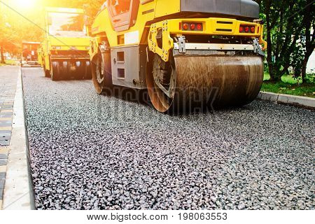 Background Of Asphalt Roller That Stack And Press Hot Asphalt. Road Repair Machine
