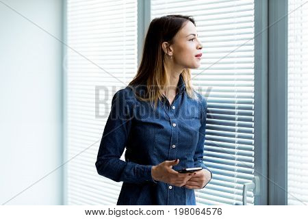 Young Woman Turning To Stare At The Camera