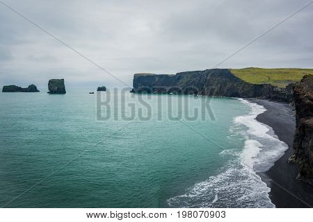 Stormy weather on the Kirkjufjara beach. Located in the south coast of Iceland, Europe.