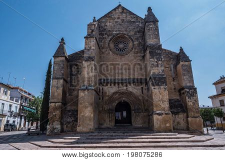 Cordoba, SPAIN - July 9, 2017: Church of Santa Marina, catholic temple site in the city of Cordoba, it is placed opposite to the monument to the toreador Manolete, Andalusia, Spain