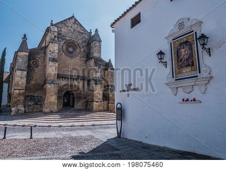 Cordoba, SPAIN - July 9, 2017: Church of Santa Marina, catholic temple site in the city of Cordoba, it is placed opposite to the monument to the toreador Manolete, Andalusia, Spain