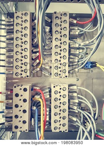 Many electric wires connected in plug. Power and test electronics.
