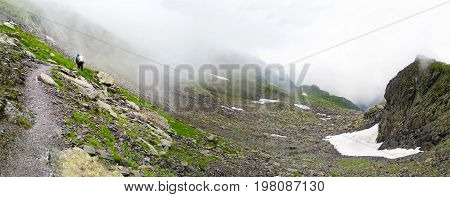 Hikers going to Negoiu peak part of Fagaras Mountain range Romania