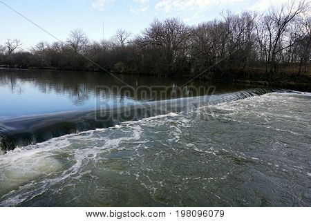 A dam crosses the Du Page River in the Hammel Woods Forest Preserve in Shorewood, Illinois.