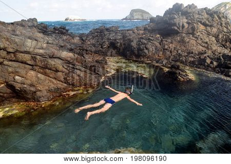 Swimming in a natural pool in Fernando de Noronha