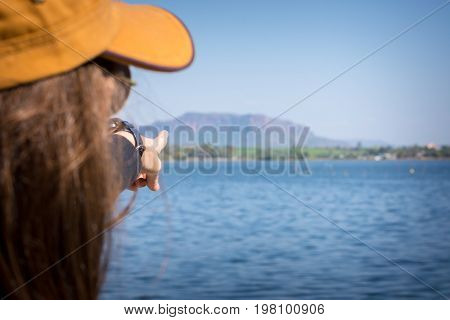 Woman Finger Pointing To The Mountain. Tourism Concept.