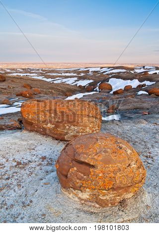 Unusual round red boulders in Red Rock Coulee in Southern Alberta, Canada.