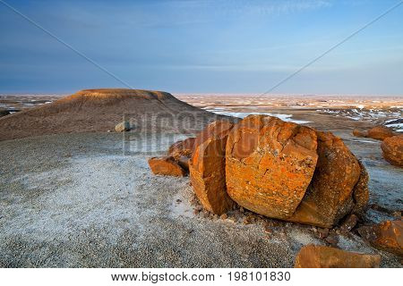Unusual round red boulders in Red Rock Coulee in Southern Alberta, Canada.