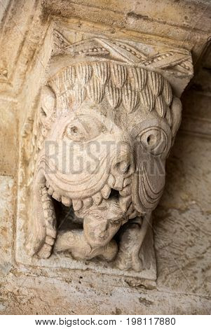Monster or Tarasque Devouring a Sinner c12th Romanesque Carving in the Cloisters Montmajour Abbey near Arles Provence France