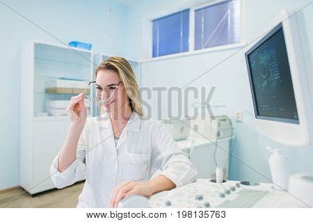 Ultrasound machine, doctor's hand usg investigation USCG.