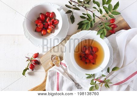 Rose hip tea and berries healthy extract. Top view