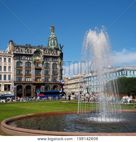 Saint Petersburg, Russia - July 30, 2017: -Singer- of the company's famous home. In the foreground the fountain in the square before the Kazan Cathedral.
