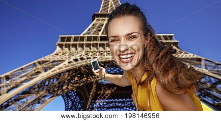 Happy Young Woman Taking Selfie With Phone In Paris, France