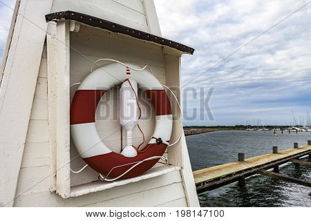 Lifesaver by the harbour oon a sunny day