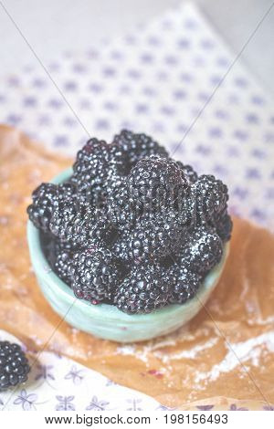 Homemade, sweet, delicious blackberries in a handmade dish