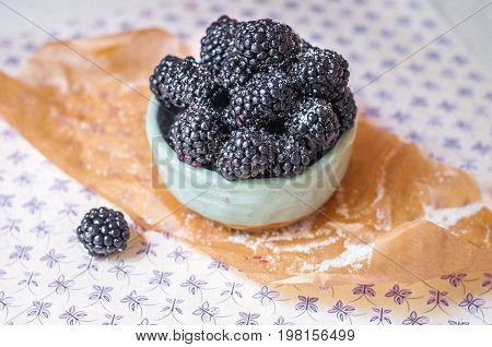 Homemade, sweet, delicious blackberries in a handmade dish