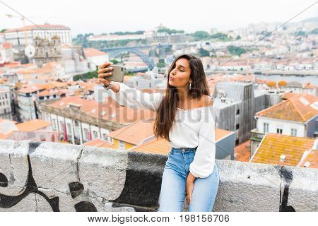 Young Beautiful Woman Tourists Take Selfie In View Point Of Porto, Portugal