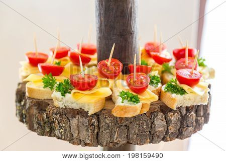 Tomatoes and cheese. Banquet feasts. Banquet table