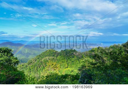 Borneo jungle and mountains landscape view with rainbow in Kokol hill,Inanam,Sabah,Borneo,Malaysia.