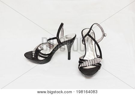 Women's shoes sandals in heels black color isolated white background.