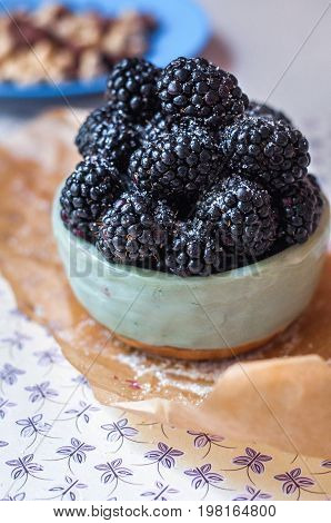 Homemade, sweet, delicious blackberries in a handmade dish