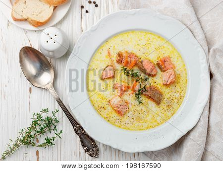 Creamy fish soup with salmon potatoes onions and carrots. Kalakeitto. Traditional dish of the Finnish cuisine