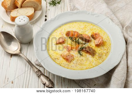 Creamy fish soup with salmon potatoes onions and carrots. Kalakeitto. Traditional dish of the Finnish cuisine