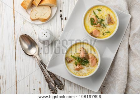 Creamy fish soup with salmon potatoes onions and carrots. Kalakeitto. Traditional dish of the Finnish cuisine