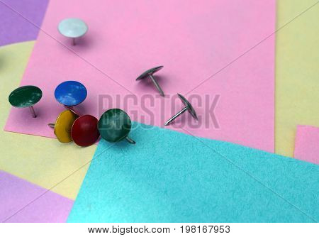 Colored sheets of paper and colorful buttons