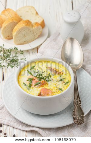 Creamy fish soup with salmon potatoes onions and carrots. Kalakeitto. Traditional dish of the Finnish cuisine