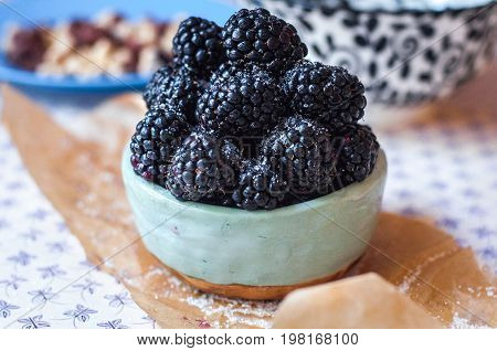 Homemade, sweet, delicious blackberries in a handmade dish