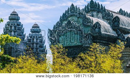 Roof of bizarre sculpture in wat with bamboo.