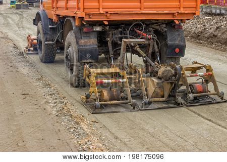 Truck Compacting Gravel At Road Construction Site 2