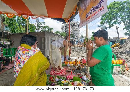 HOWRAH WEST BANGALINDIA - JULY 7TH 2017 : khutipuja the starting ritual of world famous Durga Puja (most famous festival of Hinduism) is being performed by a Hindu Priest amongst Hindu devotees.