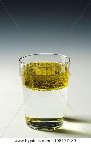 Physics. Immiscible fluids. Oil floating on water.4 of 4 image series.