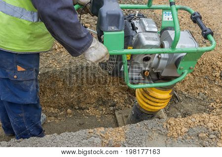 Worker With Trench Rammer 2