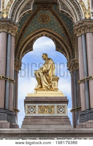 Prince Albert Memorial golden statue Kensington Gardens sculpture at the base of the monument London United Kingdom. It was commissioned by Queen Victoria in memory of her husband opened in July 1872
