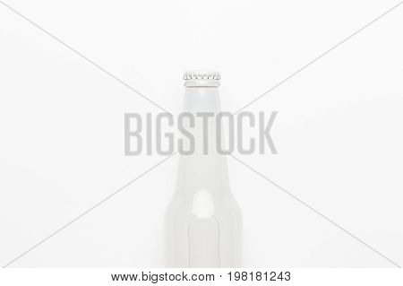 glass bottle of soda drink. top view of glass bottle on white background. white glass bottle not isolated. glass bottle of soda drink central composition