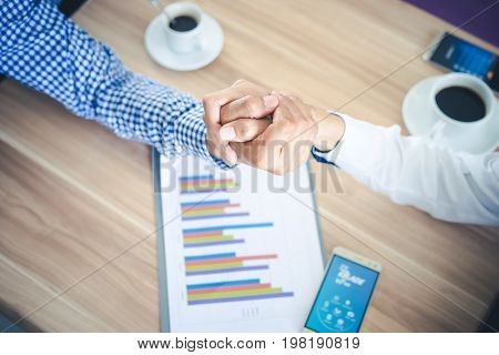 Top View Two Businessman Shaking Hands or Arm Wrestling cooperative and teamwork conceptcorporate life styleCooperation initiative achievement
