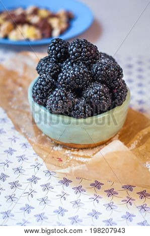 Homemade, sweet, delicious blackberries in a handmade dish